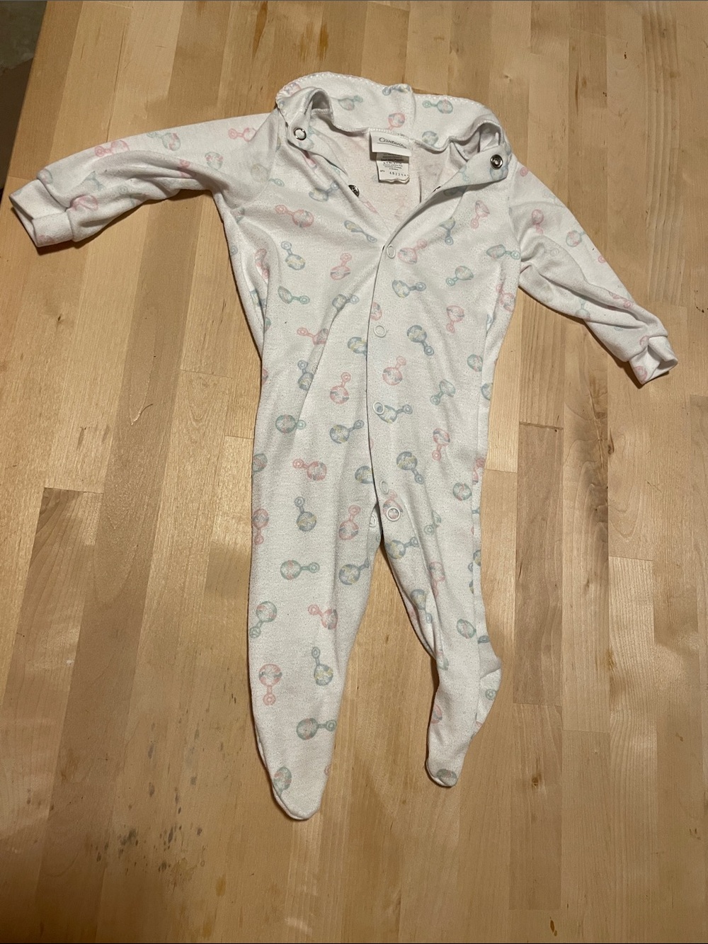 Carter's White Footed One-Piece with Pink, Blue, and Mint Rattle Print